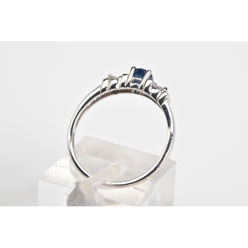 60 - A 9CT WHITE GOLD SAPPHIRE AND DIAMOND RING, designed with a central claw set circular cut sapphire, ... 