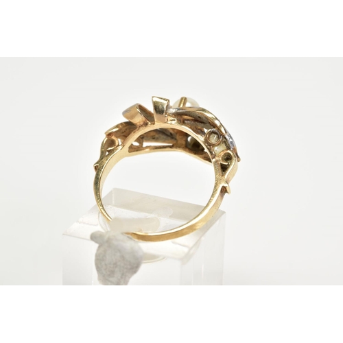 100 - A 9CT GOLD PEARL AND DIAMOND RING, the two-tone openwork ring set with a single cultured pearl and s... 