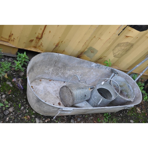 1003 - A VINTAGE GALVANISED TIN BATH length 134cm x 57cm at the widest end tapering to 48cm at the foot end... 