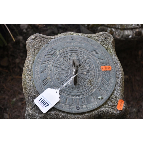 1007 - A TWO PIECE COMPOSITE GARDEN SUNDIAL with a Gothic detailed column, brass dial and square base, heig... 