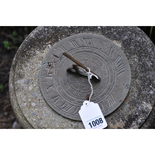 1008 - A THREE PIECE COMPOSITE SUNDIAL with a brass dial, balustered column and a square base, height 88cm