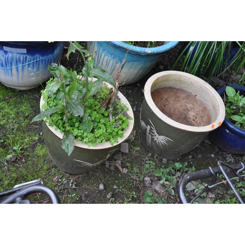 1011 - SIX GLAZED GARDEN PLANT POTS the largest being 50cm in diameter and 40cm high and a small water feat... 