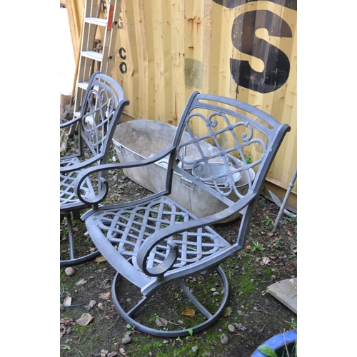 1014 - A PAIR OF CAT ALUMINIUM SWIVEL GARDEN CHAIRS seat width 51cm x height 92cm