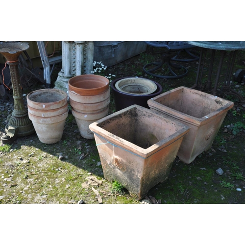 1016 - A COLLECTION OF TWELVE GARDEN PLANTERS including two tapered square section terracotta pots 48cm x 4... 