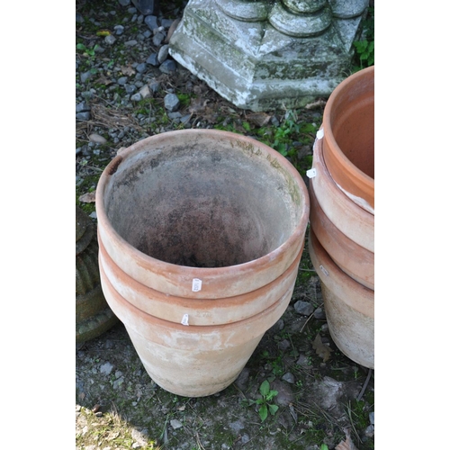 1016 - A COLLECTION OF TWELVE GARDEN PLANTERS including two tapered square section terracotta pots 48cm x 4... 