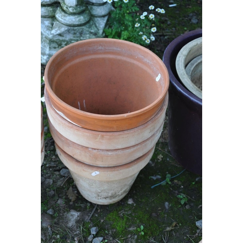 1016 - A COLLECTION OF TWELVE GARDEN PLANTERS including two tapered square section terracotta pots 48cm x 4... 