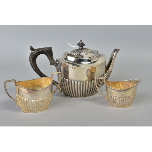 104 - A LATE VICTORIAN SILVER THREE PIECE BACHELORS TEA SET, of oval form, stop reeded decoration, makers ... 