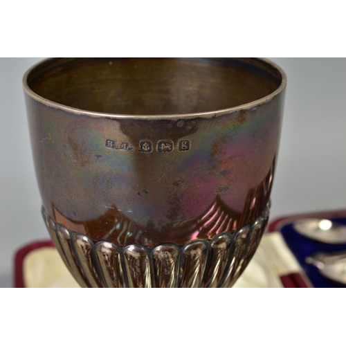 108 - AN EDWARDIAN SILVER TROPHY CUP, stop reeded decoration, slender stem with soldered repair, circular ... 