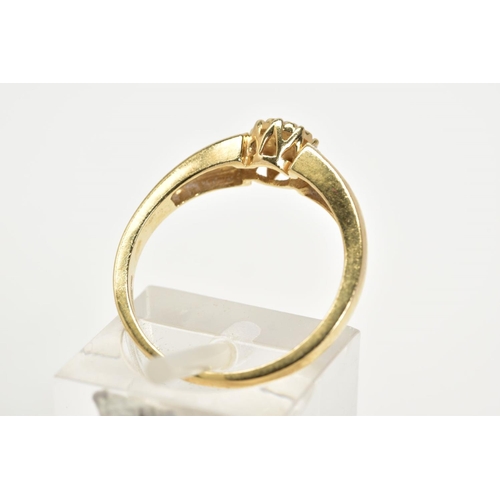 11 - A 9CT GOLD DIAMOND RING, designed with a central illusion set brilliant cut diamond with single cut ... 