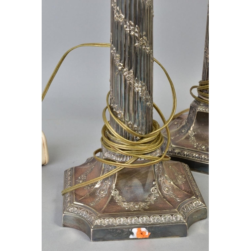 118 - A PAIR OF EARLY 20TH CENTURY SILVER PLATED TABLE LAMPS, of Corinthian column form, the fluted column... 