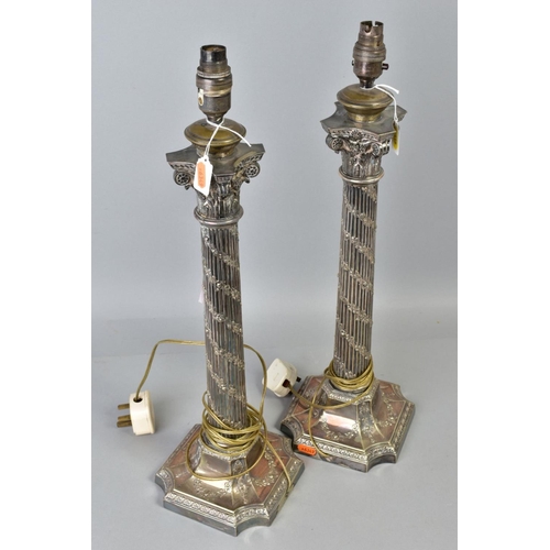 118 - A PAIR OF EARLY 20TH CENTURY SILVER PLATED TABLE LAMPS, of Corinthian column form, the fluted column... 