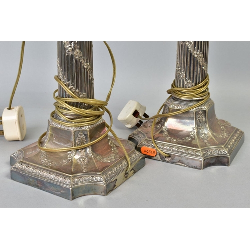 118 - A PAIR OF EARLY 20TH CENTURY SILVER PLATED TABLE LAMPS, of Corinthian column form, the fluted column... 