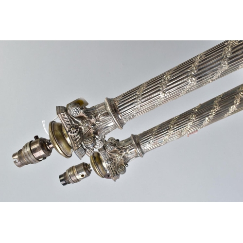 118 - A PAIR OF EARLY 20TH CENTURY SILVER PLATED TABLE LAMPS, of Corinthian column form, the fluted column... 