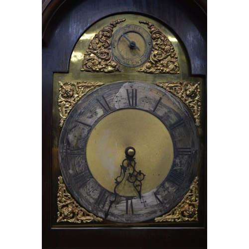 1203 - AN EARLY 20TH CENTURY MAHOGANY AND INLAID LONGCASE CLOCK, the hood with a brass finial, arched glass... 