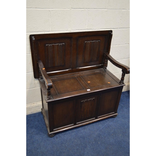 1204 - A MID 20TH CENTURY OAK LINENFOLD MONKS BENCH, width 101cm x depth 53cm x height 79cm