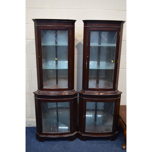 1206 - TWO MODERN MAHOGANY GLAZED SINGLE DOOR CORNER CUPBOARDS together with a modern mahogany coffee table... 