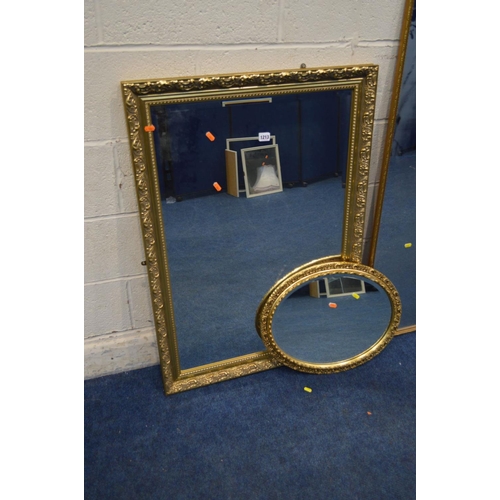 1213 - A MODERN GILT WOOD BEVELLED EDGE WALL MIRROR, 71cm x 101cm together with a heavily gilt framed bevel... 