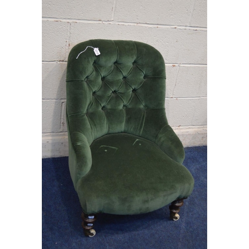 1218 - A LATE VICTORIAN GREEN UPHOLSTERED BEDROOM CHAIR on ceramic casters