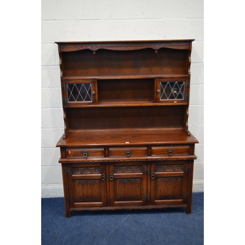 1225 - AN OLD CHARM OAK LINENFOLD DRESSER with three drawers, width 136cm x depth 44cm x height 176cm