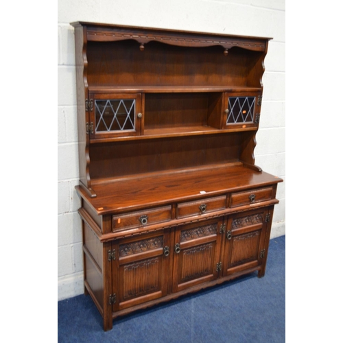 1225 - AN OLD CHARM OAK LINENFOLD DRESSER with three drawers, width 136cm x depth 44cm x height 176cm