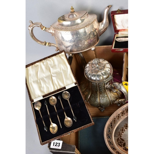 123 - A BOX OF SILVER PLATE, etc including a Victorian silver butter knife, two plated tea pots, cased, bo... 