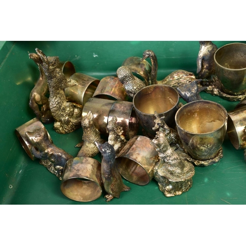 124 - A GROUP OF SILVER PLATED EGG CUPS, NAPKIN RINGS AND NUT DISHES, each with a cast bird or animal, inc... 