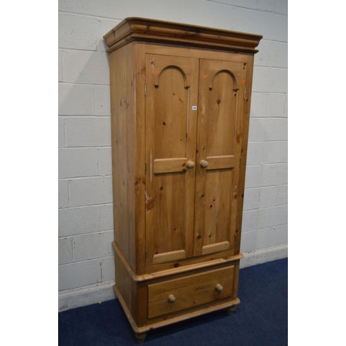 1240 - A LATE 20TH CENTURY VICTORIAN STYLE PINE TWO DOOR WARDROBE, with a single drawer, width 92cm x depth... 