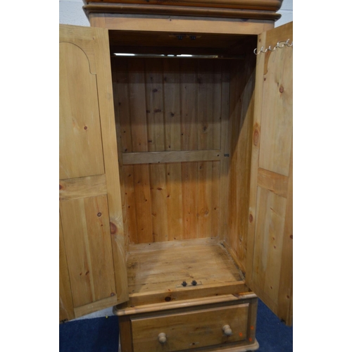 1240 - A LATE 20TH CENTURY VICTORIAN STYLE PINE TWO DOOR WARDROBE, with a single drawer, width 92cm x depth... 