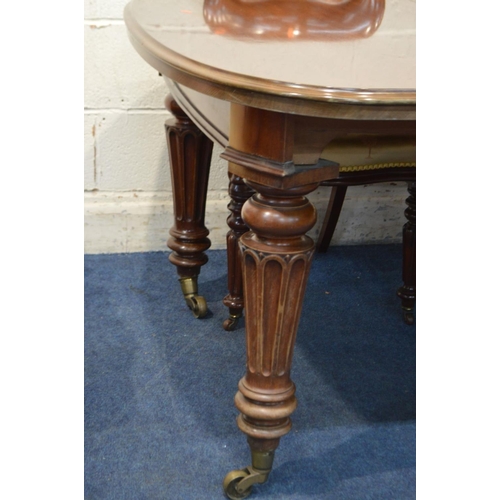 1245 - A VICTORIAN MAHOGANY WIND OUT DINING TABLE, moulded top with rounded corners, two additional leaves,... 