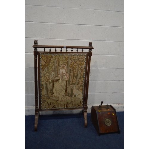 1248 - A LARGE EARLY 20TH CENTURY OAK FIRE SCREEN, with lion head's to top rail, turned and fluted upright'... 