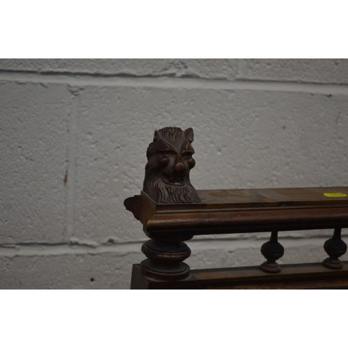 1248 - A LARGE EARLY 20TH CENTURY OAK FIRE SCREEN, with lion head's to top rail, turned and fluted upright'... 