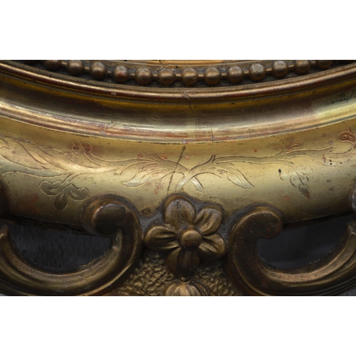 1250 - A 19TH CENTURY GILT FRAMED OVAL WALL MIRROR with gesso detailing to top and bottom edges and foliate... 