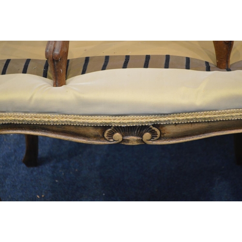 1251 - A FRENCH NARROW WINDOW SEAT with turned handles, shaped and scalloped legs and frieze with a shell d... 