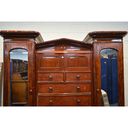 1255 - A VICTORIAN MAHOGANY COMPACTUM TRIPLE SECTION WARDROBE, the two outer sections with individual corni... 