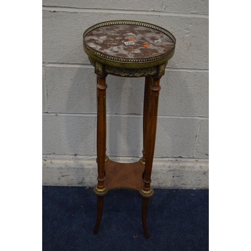 1258 - A LATE 20TH CENTURY CIRCULAR MARBLE TOPPED AND WALNUT TORCHERE STAND, with a brass gallery and folia... 