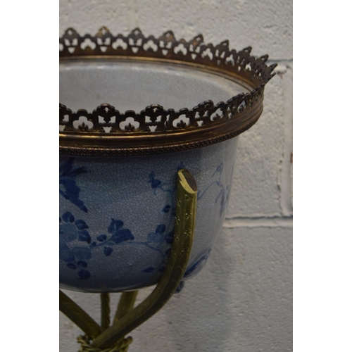 1259 - A LATE 20TH CENTURY ORIENTAL STYLE CRACKLE GLAZE BLUE AND WHITE POTTERY JARDINIERE, on a seperate br... 