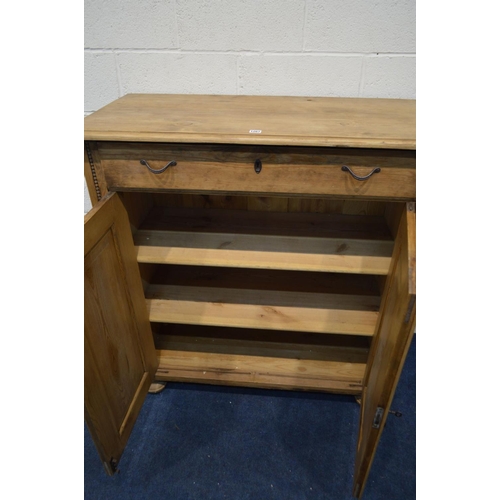 1267 - A 20TH CENTURY PINE PANELLED TWO DOOR CABINET with a single drawer, width 110cm x depth 52cm x heigh... 