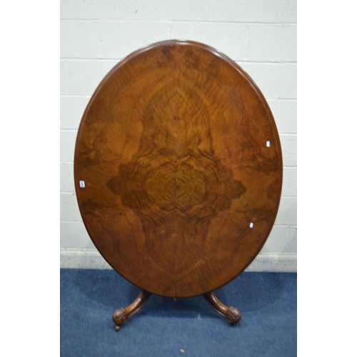 1294 - A LATE VICTORIAN BURR WALNUT OVAL TOPPED LOO TABLE, the tilt top on four legged  base, length 143cm ... 