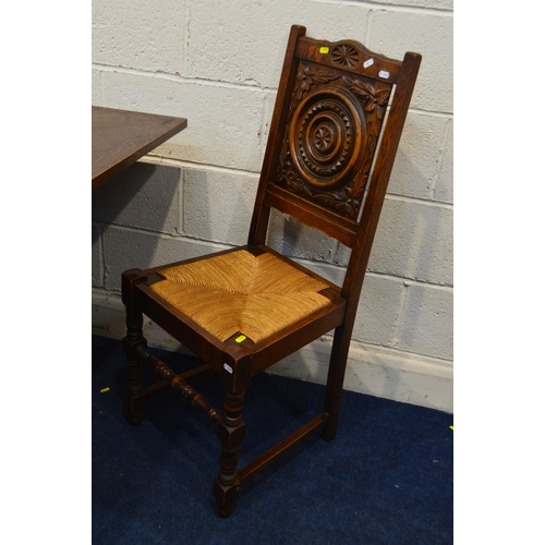 1300 - AN EARLY 20TH CENTURY OAK DRAW LEAF BRETON TABLE, raised on four standing figures united by stretche... 