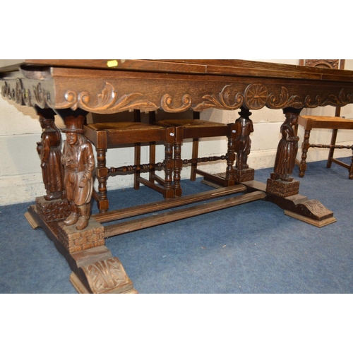 1300 - AN EARLY 20TH CENTURY OAK DRAW LEAF BRETON TABLE, raised on four standing figures united by stretche... 