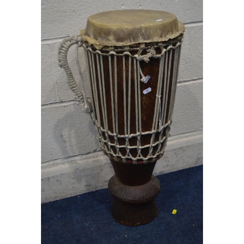 1308 - A TRIBAL BONGO DRUM, diameter 30cm x height 73cm