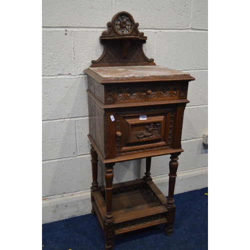 1309 - AN EARLY 20TH CENTURY CARVED OAK BRETON POT CUPBOARD, with a veined marble top, and single drawer an... 