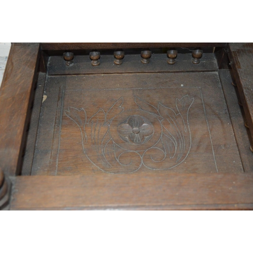 1309 - AN EARLY 20TH CENTURY CARVED OAK BRETON POT CUPBOARD, with a veined marble top, and single drawer an... 