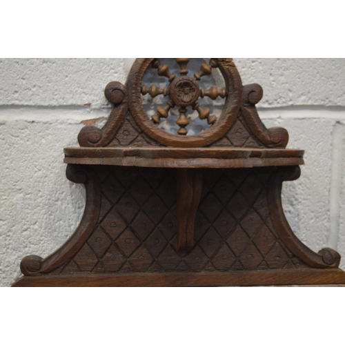 1309 - AN EARLY 20TH CENTURY CARVED OAK BRETON POT CUPBOARD, with a veined marble top, and single drawer an... 