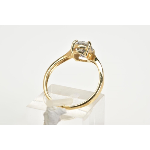 131 - A 9CT GOLD TOPAZ AND DIAMOND RING, designed with a claw set oval cut coated topaz (mystic topaz) fla... 