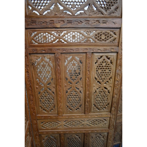 1310 - AN ANGLO INDIAN HARDWOOD FOUR FOLD FLOOR STANDING SCREEN, each panel width 51cm x overall width 204c... 