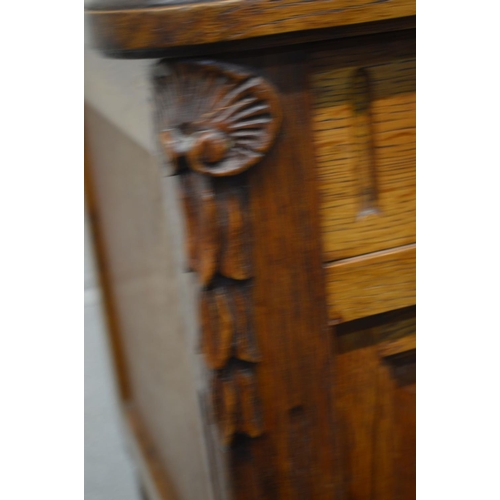 1311 - AN EARLY 20TH CENTURY OAK POT CUPBOARD, with white veined marble top, single drawer and ceramic inte... 