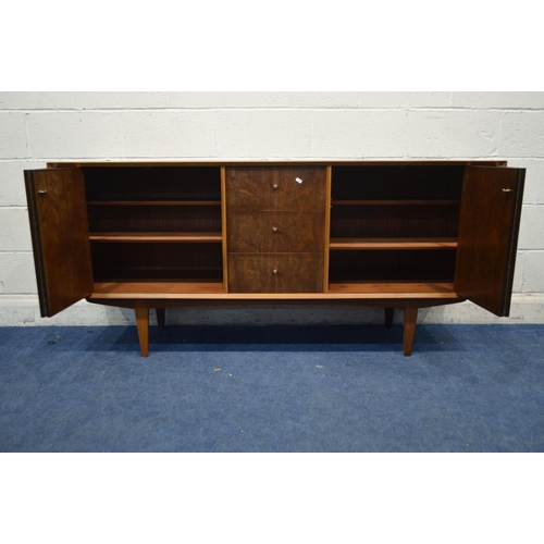 1317 - A MID 20TH CENTURY VANSON TEAK SIDEBOARD, two double bi fold doors flanking three drawers, on taperi... 