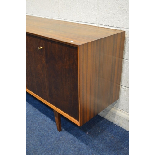 1317 - A MID 20TH CENTURY VANSON TEAK SIDEBOARD, two double bi fold doors flanking three drawers, on taperi... 