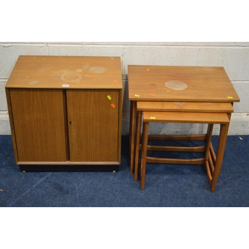 1322 - A MID 20TH CENTURY TEAK TWO DOOR RECORD CABINET together with a teak nest of three tables (sd to fin... 